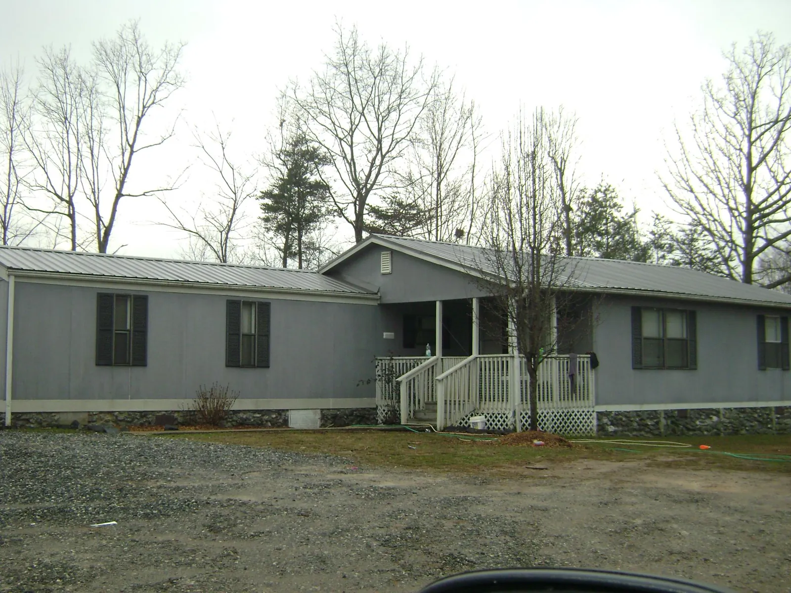 Metal roof over a manufactured home with a covered front porch in Lovelock